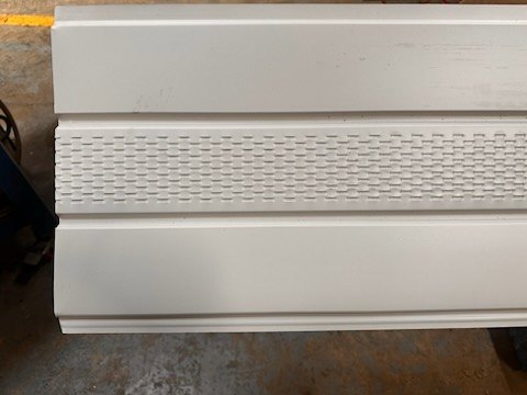 Triple 4 vented soffit fabricated by Omega Metals